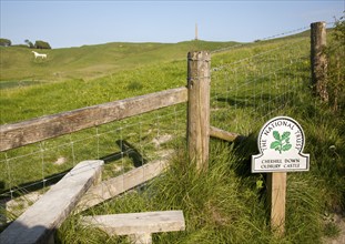 National Trust sign Cherhill Down and Oldbury Castle with Lansdowne monument, Cherhill, Wiltshire,