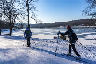 Winter in the Ruhr area, Lake Baldeney, snowy, partly frozen lake, Essen, cross-country skier,