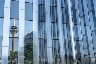 The Rhine Tower reflected in a glazed façade, RWI building, Düsseldorf, North Rhine-Westphalia,