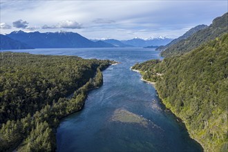 Western shore of lake Todos los Santos, river Rio Puertohue flowing into the lake, chilenean lake