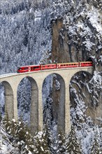 Rhaetian Railway train at the famous Landwasser Viaduct on the Albula railway Stadler Rail