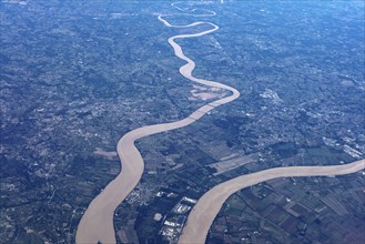 Aerial view of a winding river flowing through a rural landscape, flight, aerial view