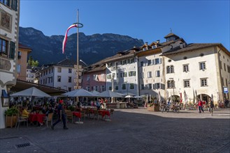 The village of Kaltern, on the South Tyrolean Wine Road, market square, South Tyrolean flag, Italy,