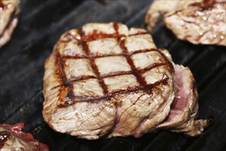 Steak on the grill with diamond pattern