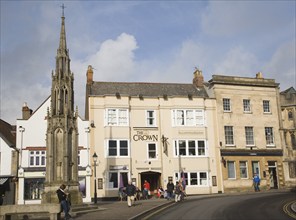 Crown Hotel and market cross in historic Market Place, Glastonbury, Somerset, England, United