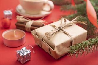 Christmas or New Year composition. Decorations, box, cinnamon, fir and spruce branches, cup of