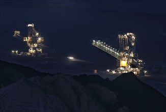 Lignite excavators extract coal in the Welzow open-cast mine, operated by LEAG. The lignite is