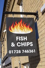 Fish and Chips sign sign outside chip shop, Wickham Market, Suffolk, England, UK