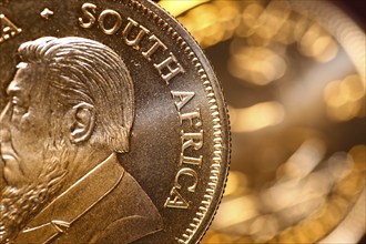 Close-up of two Krugerrand gold coins