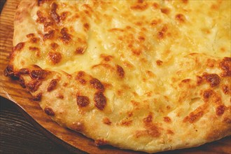 Imereti khachapuri, Traditional Georgian dish, flatbread with cheese, top view, no people, rustic