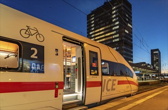 Railway station, ICE train on platform, skyline of Essen city centre, North Rhine-Westphalia,