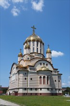 A church with golden domes and a Christian cross under a blue sky, Orthodox Cathedral of St John