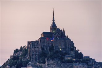 Dusk at Mont Saint Michel, rocky monastery island in the Wadden Sea, sheep, Le Mont Saint Michel,