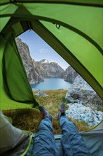 Wild camping, camping in the wilderness with a tent, Kol Suu mountain lake, Sary Beles Mountains,