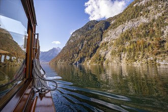 Tourist boat on the Königssee, autumnal mountain landscape reflected in the lake, Berchtesgaden