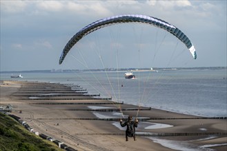 Paragliders along the dunes of Zoutelande, in Zeeland, South Holland, Netherlands