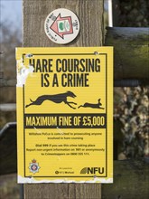 Hare coursing is a crime NFU, National Farmers Union notice, Wiltshire, England, UK