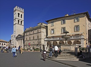 Piazza del Comune market square and Santa Maria sopra Minerva church in Assisi, Umbria, Italy,