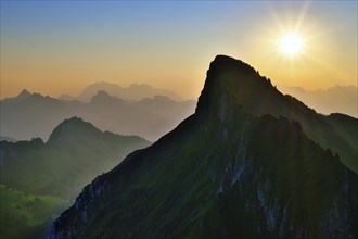 Tierberg at sunrise, behind it the Appenzell Alps with Alpstein and Säntis, cantons of Glarus and