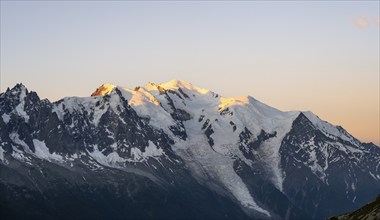 Morning atmosphere, mountain landscape at sunrise, glaciated mountain peak of Mont Blanc in the