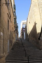 Steep historic street in city centre of Valletta, Malta, Europe