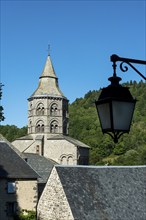 Orcival in Auvergne Volcanoes Regional Natural Park. Bell tower of the Notre-Dame d'Orcival