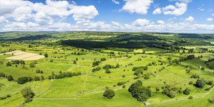 Farms and Fields over Bainbridge Village from a drone, Leyburn, North Yorkshire, England, United