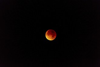 The moon with starry sky, blood moon, taken in the Swiss mountains, Switzerland, Europe