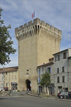 Porte d'Orange, city gate with battlements and French national flag, defence defence tower,