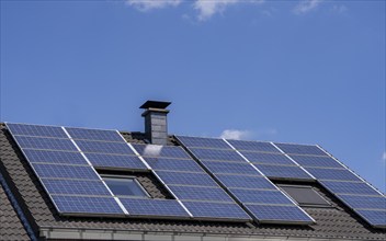 Solar system on the pitched roof of a residential building, photovoltaics for power generation, for