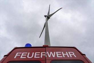 Height rescuers from the Oberhausen fire brigade practise abseiling from a wind turbine from a