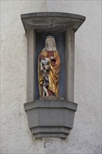 Figure of a saint in a niche of a residential building, Rottweil, Baden-Württemberg, Germany,