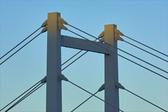 A modern bridge at sunset with clear cable structures and a cloudless sky, Würzburg, Mainfranken,