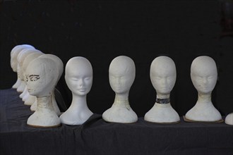 Heads made of polystyrene at a hat dealer's stand on Campo de Fiori, Rome. Italy