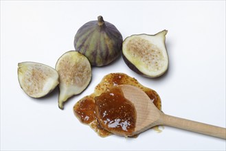 Fig jam in cooking spoon and fresh figs, Ficus carica