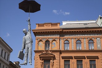 Man jumping with umbrella, art object in Prague, Czech Republic, Europe