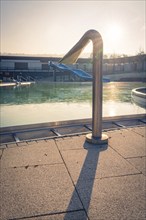 Outdoor pool with an outdoor shower in the shining sunlight, ENCW outdoor pool Calw, Stammheim,