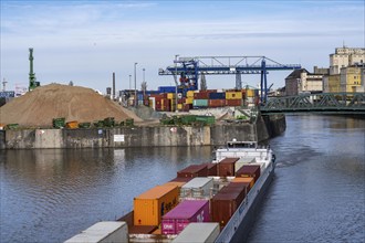 Container freighter Aarburg, leaving the container terminal in Frankfurt Osthafen, belonging to