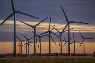 Wind farm near the East Frisian town of Norden, east of the town, sunset, Lower Saxony, Germany,