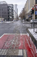 Onset of winter, poorly cleared cycle lane, in the city centre of Frankfurt, Hesse, Germany, Europe