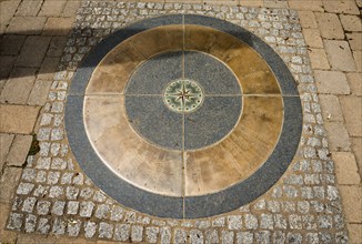 Compass rose mosaic in the ground, surrounded by cobblestones, Schengen, Canton of Remich, Grand