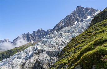 Glacier ice of the Glacier des Bossons with summit of the Aiguille du Midi, Chamonix, Haute-Savoie,