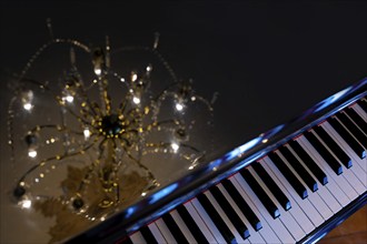 Crystal Lamp Reflected on a Piano in Switzerland