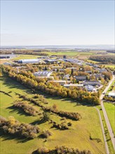 Panoramic view of an industrial area, surrounded by fields and autumnal forest, high ropes course,