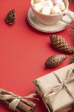 Christmas or New Year composition. Decorations, box, cinnamon, cones, fir and spruce branches, cup