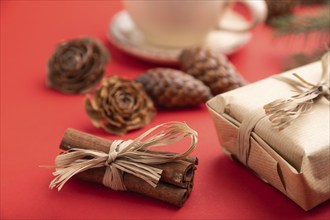 Christmas or New Year composition. Decorations, box, cinnamon, cones, fir and spruce branches, cup