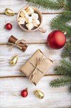 Christmas or New Year composition. Decorations, box, red balls, cinnamon, fir and spruce branches,