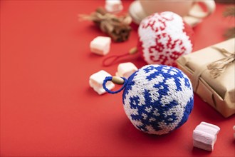 Christmas or New Year composition. Decorations, box, cinnamon, knitted balls, fir and spruce