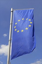 Flag of the European Union in front of a blue sky