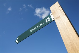 English Heritage signpost arrow for the Neolithic Hatfield earthworks site at Marden, Wiltshire,